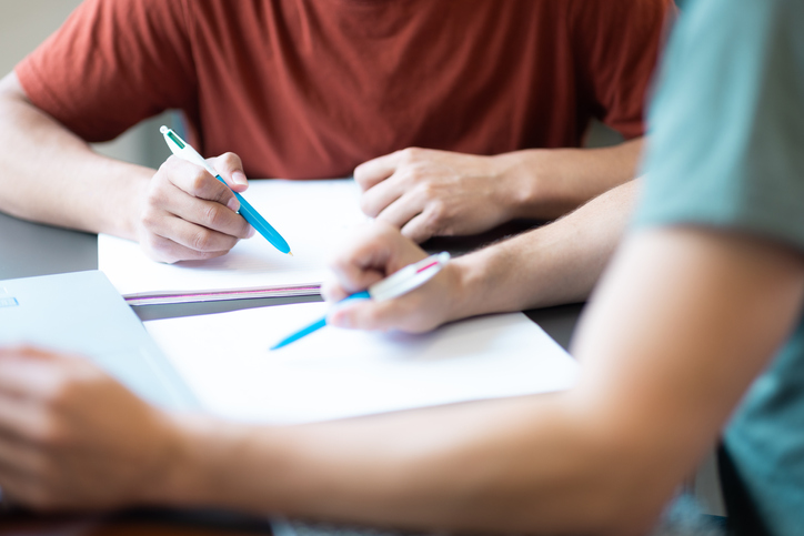 staff helps student with work